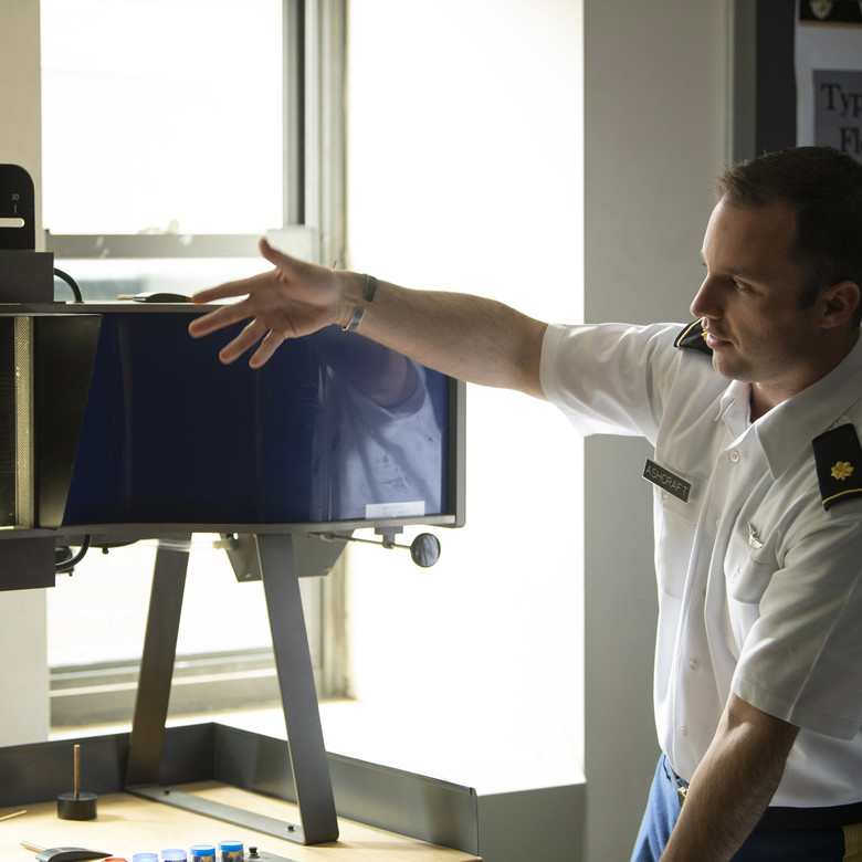 An instructor gestures while teaching at West Point.